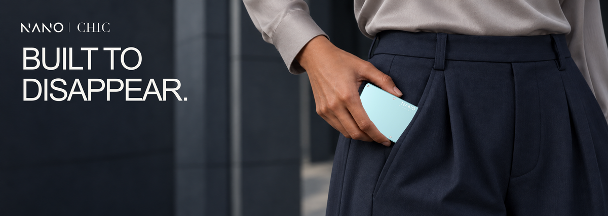 NANO CHIC Ocean Mist — Built to disappear. Model in dove-grey and navy with the original Ocean Mist wallet.