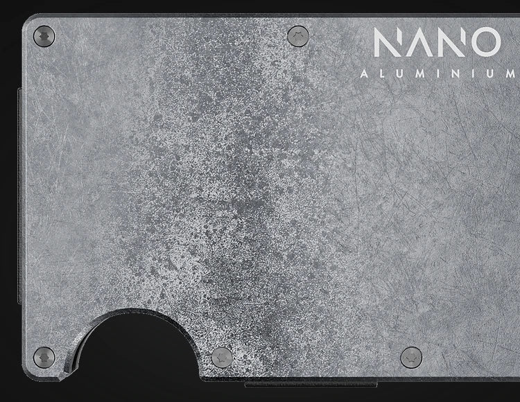 A close-up of the silver-finish NANO Wallet from the approved campaign.