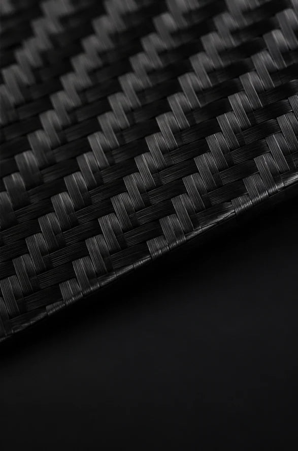 Close-up material study of the woven Carbon Fibre 3K pattern