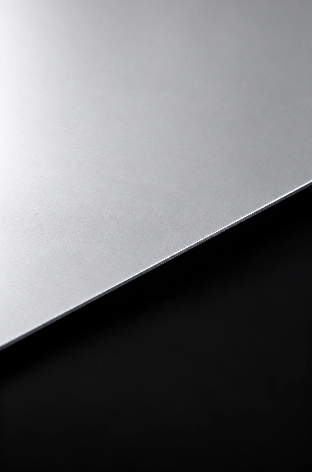 Platinum-toned material study with a cool, refined finish.