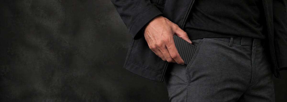 NANO Carbon Fibre 3K wallet slipping naturally into a trouser pocket.